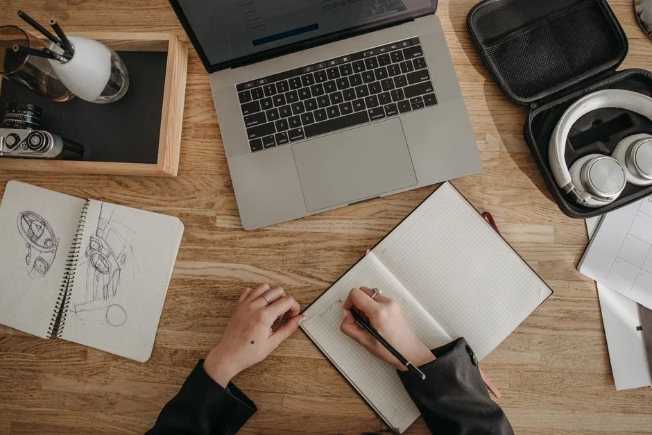 A contemporary workspace showcasing a laptop, tablet, and smartphones, ideal for tech and freelance use.